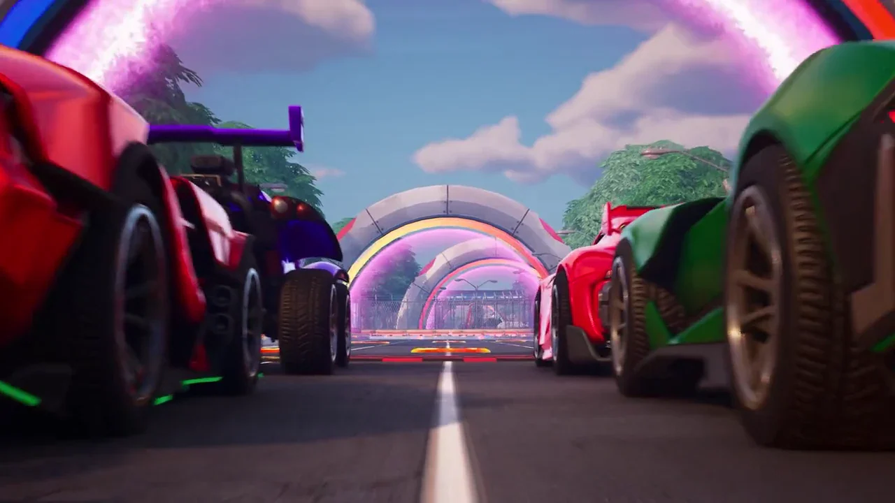 Racing cars line up on the NASCAR Chicago course beneath glowing track arches.