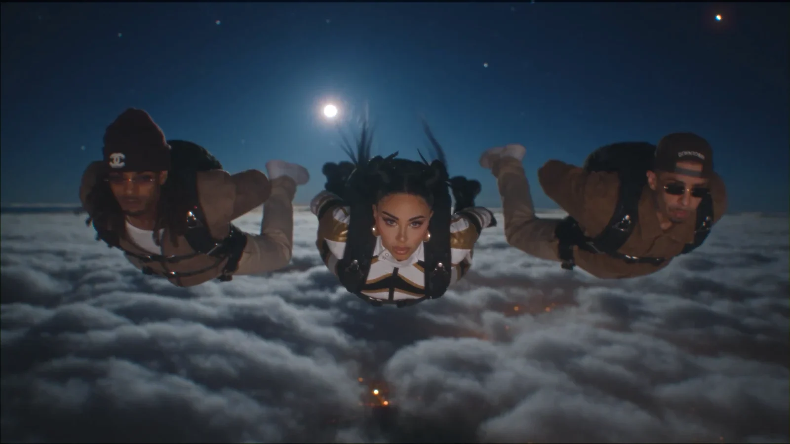Dappy, Tulisa and Fazer skydiving above clouds in N-Dubz’s The Legacy.