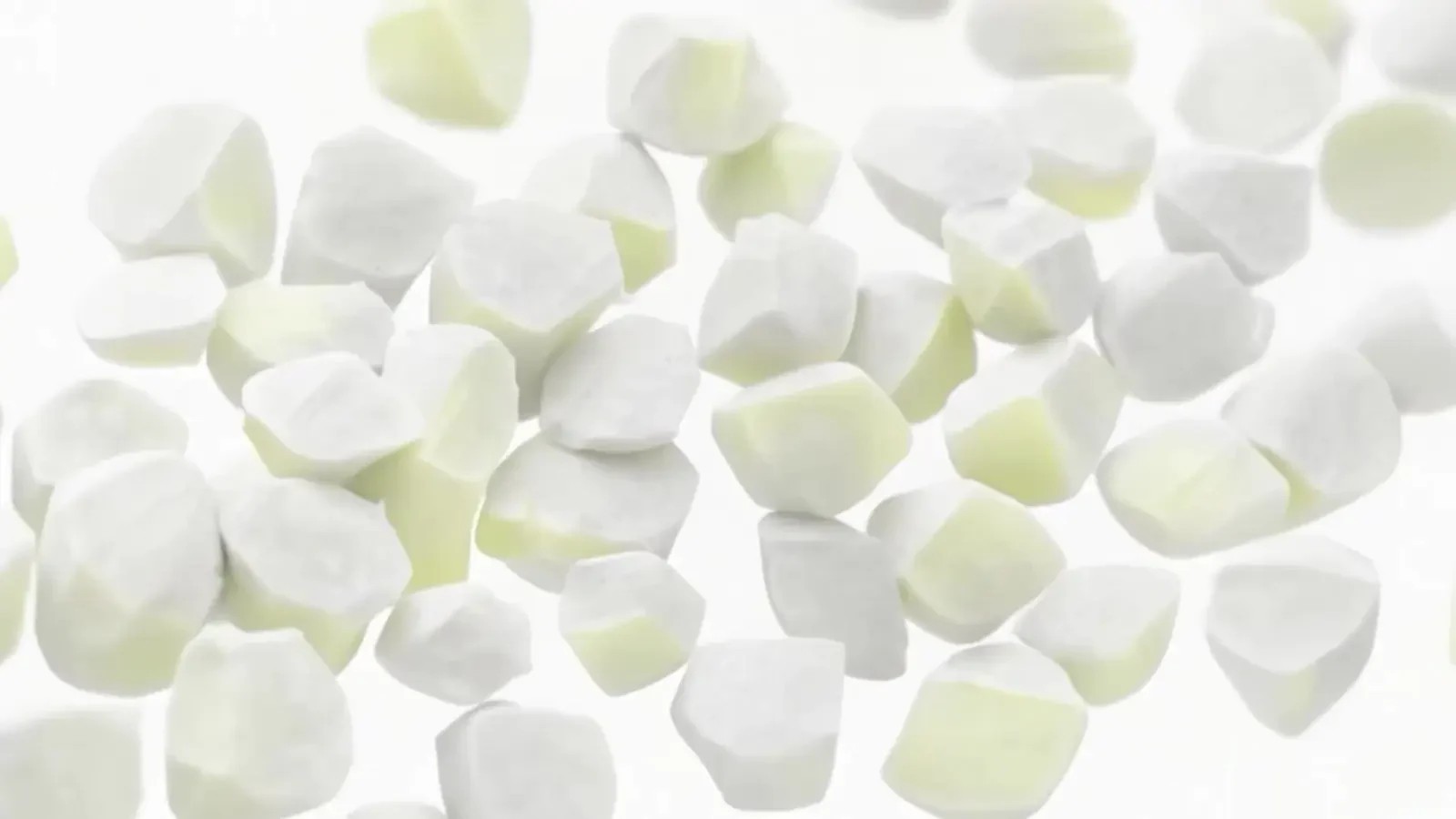 Pale abstract particles floating against white in the FibreTrace product animation.