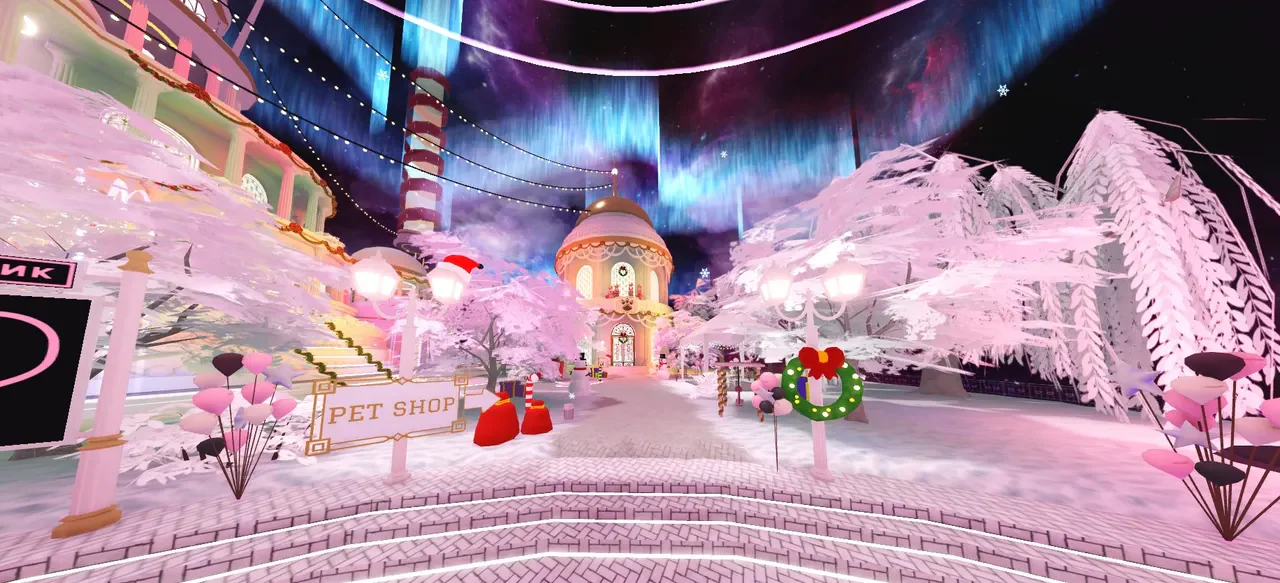 The BLACKPINK palace hub with pink trees, branded signs and a colourful night sky.