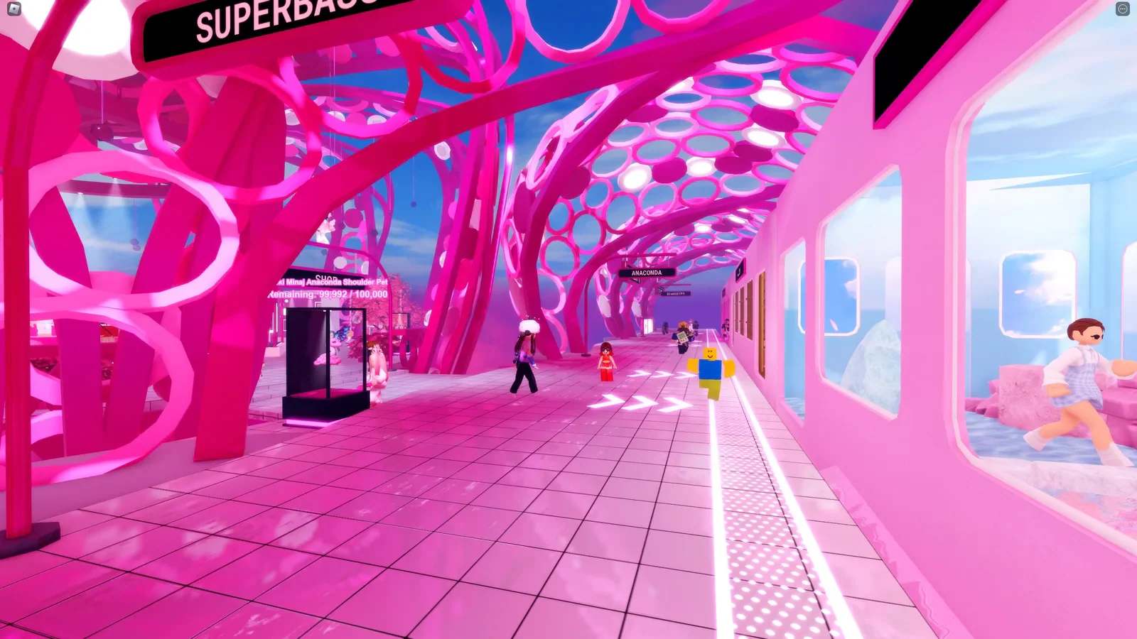 Pink architectural forms and merchandise displays inside Nicki Minaj's Roblox world.